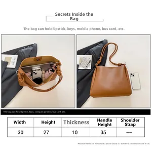 Guide des tailles pour ce sac cabas marron vintage de 30cm de large et détails de capacité