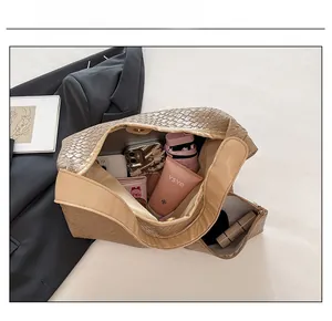 Detailed interior of a brown woven tote bag showing large capacity for daily essentials