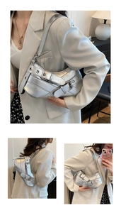 Detail of silver Y2K shoulder bag featuring pleated texture and metallic buckle accents
