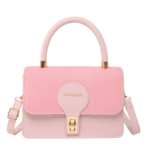 Pink minimalist crossbody bag with woven texture flap and golden hardware on white background