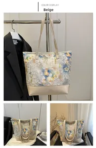 Detail of colorful floral pattern on a beige leather tote bag with sturdy handles