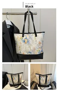 Detail of colorful tassel tote bag with black leather base and slim shoulder straps