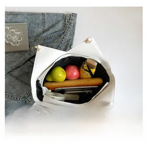 Top view of white large capacity tote bag showing interior space with daily essentials