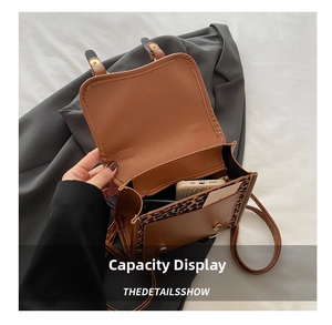 Detailed interior of a leopard print crossbody bag showing phone and card storage capacity
