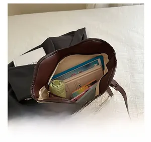 Top view of spacious cream tote bag interior with tablet and books for daily commute