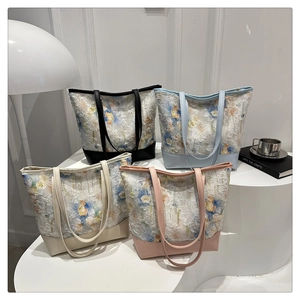 Group display of high-capacity floral tote bags in black, blue, beige and pink finishes