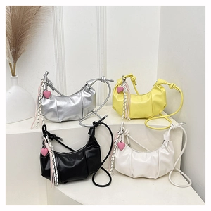 Minimalist half-moon pleated crossbody bags in silver, yellow, black, and white colors