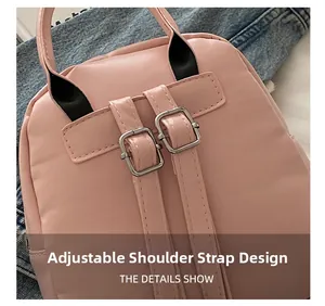 Close-up of adjustable silver buckles and stitching on pink fashion mini backpack