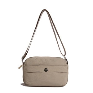 Minimalist beige nylon crossbody bag with multi-layer waterproof design and metal logo