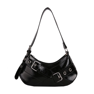 Chic black patent leather baguette shoulder bag with silver buckle and Y2K aesthetic