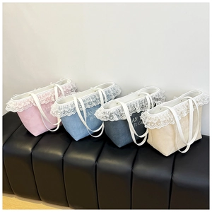 Lace-trimmed tote bags in multiple colors featuring elegant embroidery details