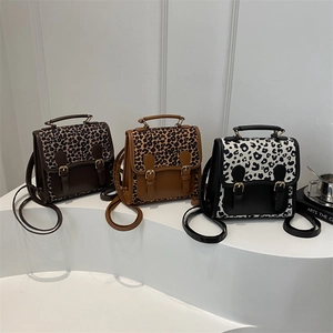 Three leopard print leopard crossbody bags in dark coffee, light brown and classic black