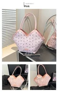 Detailed view of pink bubble bow tote bag with golden brand plate and V-shaped opening