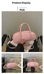 Detail of pink glossy PU leather Boston bag with dual handles and slim shoulder strap