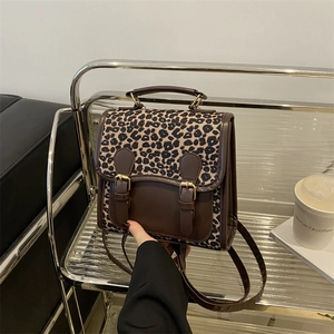 Chic leopard print backpack in brown faux leather, hand-held fashion travel bag for women