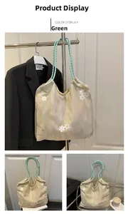 Close-up of green embroidery floral tote bag with woven rope handle and garden style