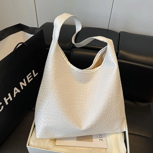 Minimalist white hobo tote bag with woven texture for women, stylish commuting shoulder bag