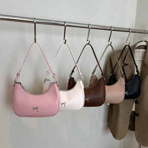 Minimalist crescent underarm bag with silver bow accent in five versatile colors