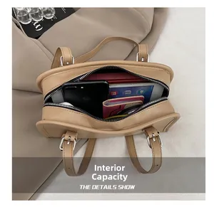 Top view of khaki minimalist handbag interior showing spacious capacity and zipper