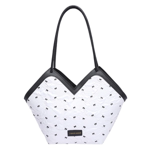 Quilted white bucket bag with black bow patterns and elegant V-shaped top opening