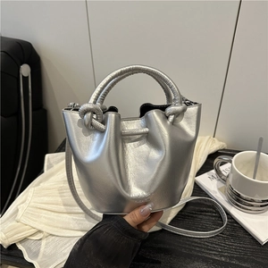 Silver pleated bucket bag with knotted handle and shoulder strap for casual wear
