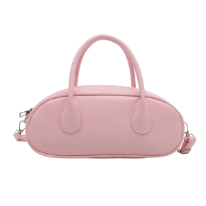 Minimalist light pink bowling bag for women with dual handles and crossbody strap