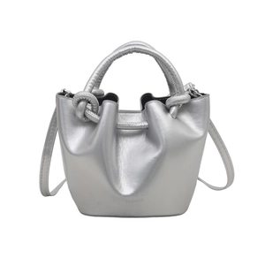 Silver pleated bucket bag with knot handle and shoulder strap for casual crossbody wear