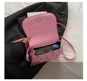 Pink shoulder bag interior showing spacious capacity for phone and cosmetics