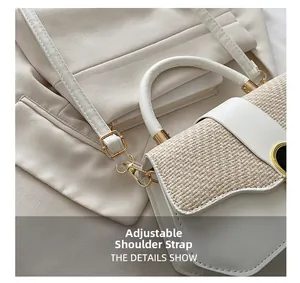 Detail showing adjustable leather shoulder strap with gold metal buckle on white woven bag