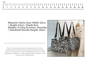 Detail view of animal print canvas tote with dimensions 32x23x8cm and leopard pattern
