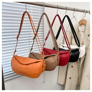 Detailed view of the textured leather texture and five color options for the crossbody bag