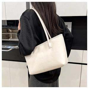 Minimalist beige tote bag shown from a back perspective for style and size scale