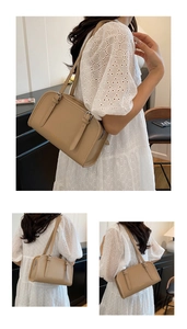 Close-up of beige leather handbag texture with gold Fashion & Bag logo engraving