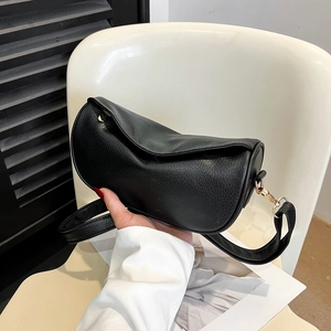 Chic black lychee grain leather crescent bag with gold hardware and shoulder strap