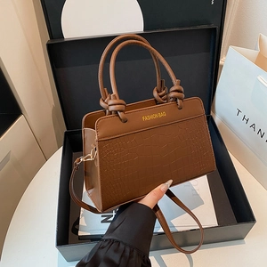 Brown crocodile texture saddle handbag with knotted handle and shoulder strap in gift box