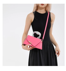 Pink handbag with unique silver liquid metal artistic handle and adjustable strap