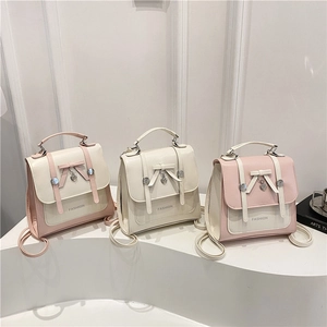 Minimalist bicolor PU leather backpack with bow heart pendant and fashion lettering