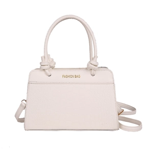 White faux leather crossbody bag with crocodile embossing and knotted handle detail