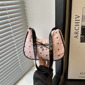 Pink bow crescent underarm bag with metallic heart pendant and fabric texture