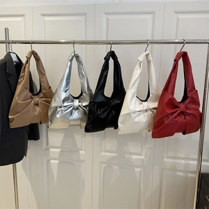 Chic underarm tote bags with large bow design in five colors including silver and brown
