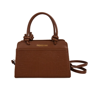 Brown faux leather tote bag with crocodile pattern and detachable shoulder strap