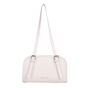 Minimalist white faux leather handbag with adjustable gold-buckle straps and brand lettering