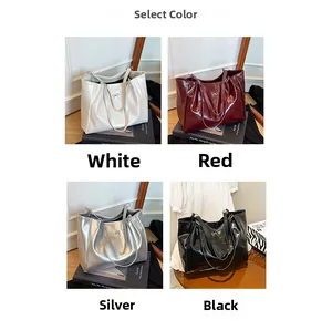 Detailed selection of glossy leather tote bags with metal bows in four elegant colors