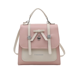 Pink and beige color-block small backpack with heart pendant and bow detail