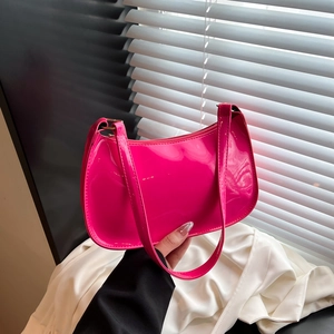 Rose pink glossy patent leather crescent shoulder bag for women with sleek design