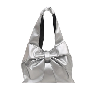 Silver metallic bow tote bag with textured ruffles and knotted shoulder strap design