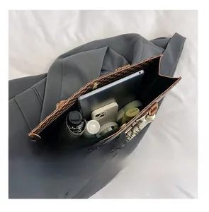 Internal view of a vintage monogram tote bag showing capacity for iPad and daily essentials