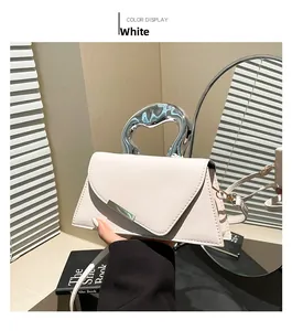 Detail of white PU leather trapezoid handbag with unique silver irregular metal handle