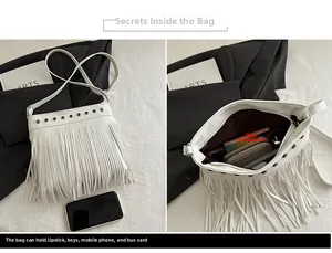 Vue détaillée du sac seau blanc à franges montrant le compartiment et le cuir grainé