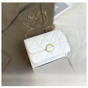 Detailed comparison of white quilted chain bag size next to a modern smartphone